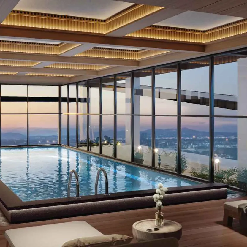 The heated rooftop pool on the Skydeck, with the city beyond its glass walls