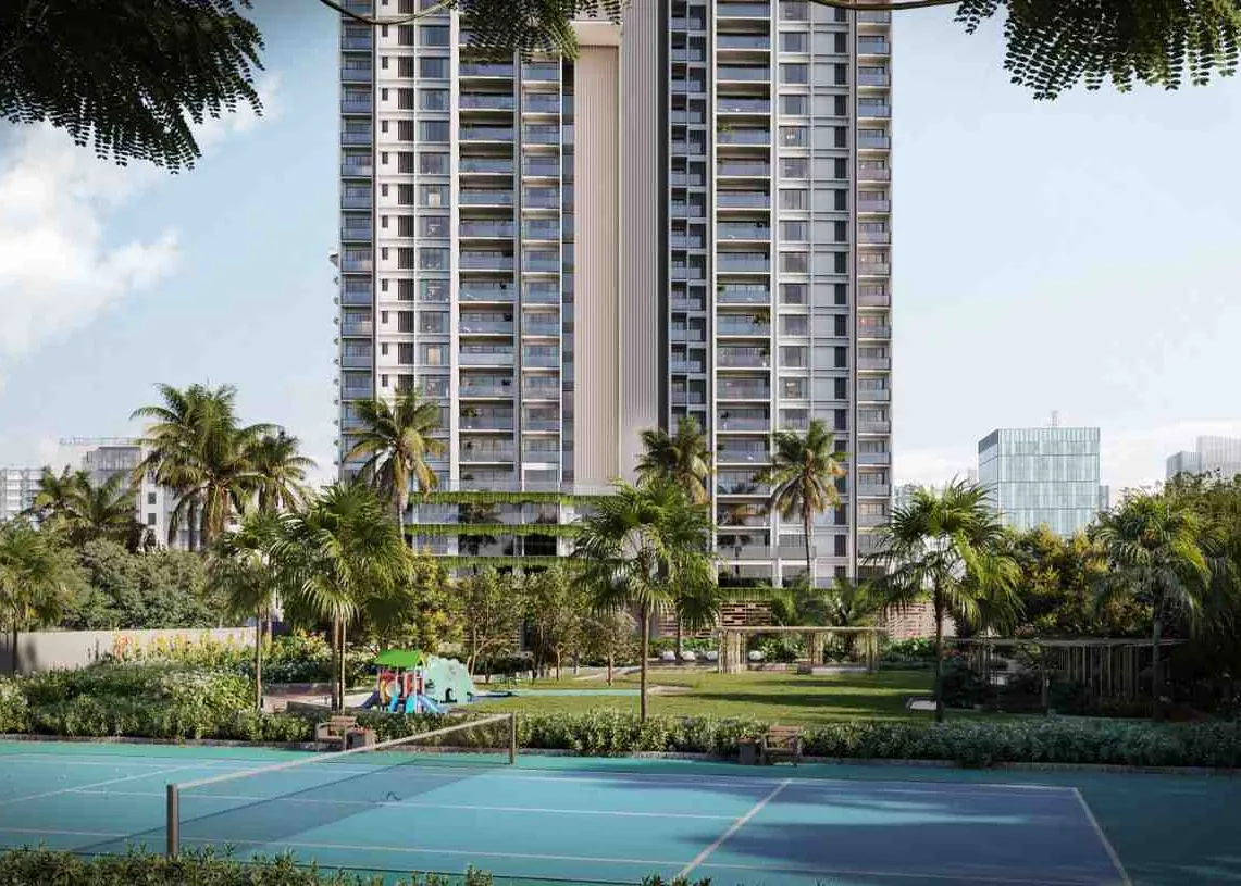 The Ayatana Residences tower rising behind a tennis court and palm gardens