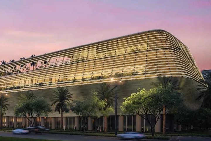 The curved convention centre of the planned hotel at sunset